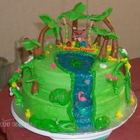 Curious George Curious George done in chocolate and strawberry filling. Covered in buttercream, and the trees and all are mmf. First time I used that. I...