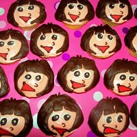 Happy Birthday Dora The Explora! This is following a description video given by nickjr.com - melted chocolate hair traced off of an outline online, cooled and placed on...