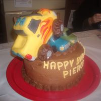 Monster Truck Rally My secretaries sons birthday cake. They wanted his favorite monster truck driving over cars. I made the smaller car and truck out of rice...