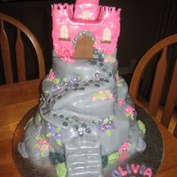 Pink Castle Cake Pink castle is RKT as is path, rest is cake, all covered in fondant. Inspired by Debbie Brown's cake