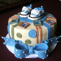 Buttons And Converse Baby Shower Cake Someone brought me a picture of the cake they wanted for a baby shower, so I don't know who to give credit to for the basics of the...