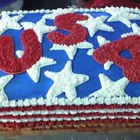 Memorial Day Cake This is a quarter sheet cake iced in buttercream. The stars were stamped onto the cake then the letters we stamped using cookie cutters....