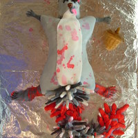 Roadkill Squirrel This was a special request from a friend. That tail is made of lots of raw spaghetti noodles covered in fondant.