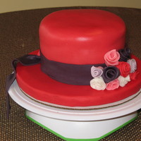 50Th Red Hat Birthday Cake This cake was made for a woman joining The Red Hat Society.Cake covered in fondant. Ribbon Roses on the front of the hat. Hat tail...