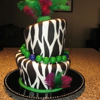 Funky Cake 6" and 8" vanilla cake with buttercream and MMF. All decorations edible except the feathers. Thanks CC for all the great ideas!