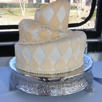 Topsy Turvy Wedding Cake This was my very first wedding cake and my very first topsy turvy cake. The decorations are all fondant with buttercream around the bottom...