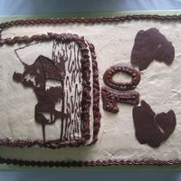 Fishing Made for my Dad's 70th b-day. Black Joe cake w/ PB icing & chocolate transfer of my dad sitting in his boat fishing.