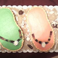 Flip Flop Cakes The pic is horrible! Taken with DH phone. The colors are actually bright pink and green. Just like her invite. Trimming done in orange....