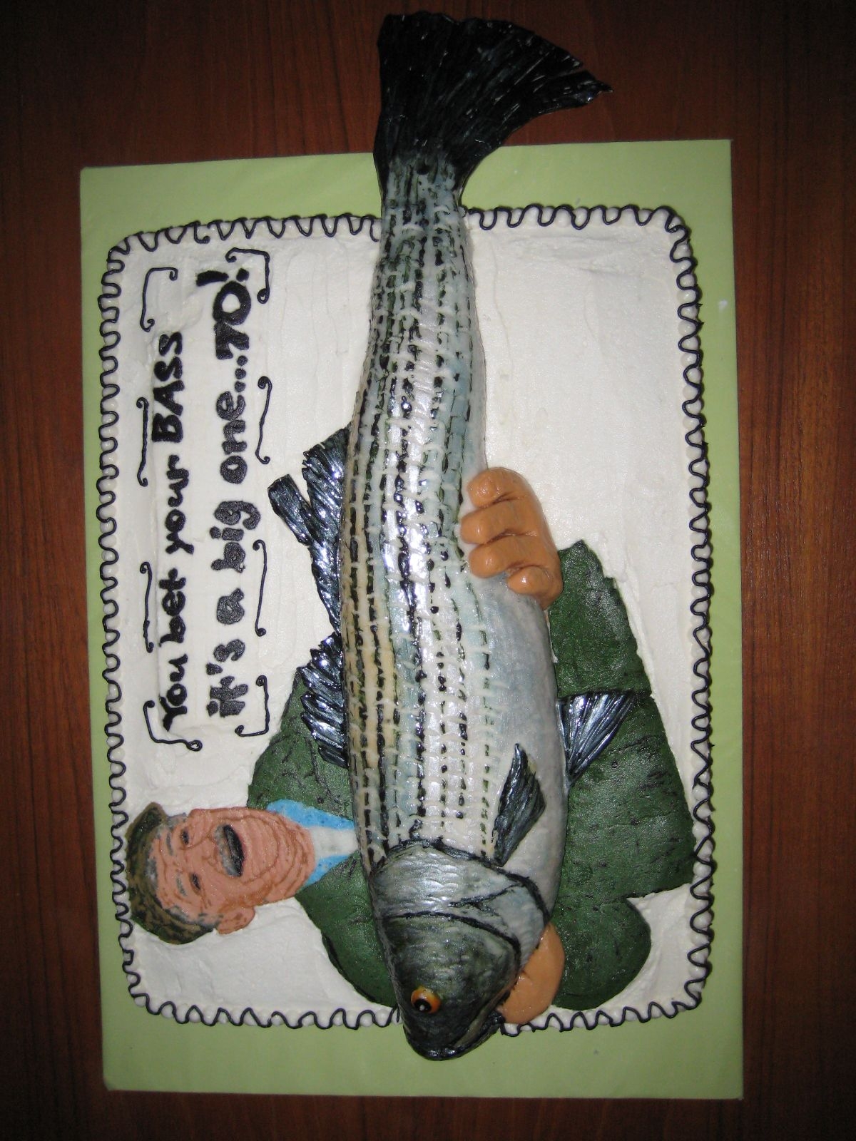 Fish Cake Made for my Dad's 70th b-day. He gave me a picture of him holding a striped bass & asked me to make a fish cake. WASC cake covered...