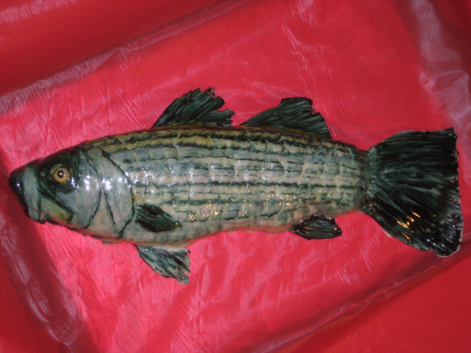 Practice Fish My dad wanted a fish cake for his b-day so I did a practice cake to try to figure out how to do it. I carved the fish then covered it in...