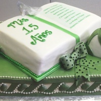 Quinceanera The birthday girl designed this cake herself! a full sheet cake topped with a half sheet cake carved like a book with a poem on it bows w/...