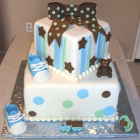 Baby Shower For A Boy 6" and 10" square chocolate cake with lemon cream cheese filling. Everything made from fondant, the shoes, bow, teddy bear,...