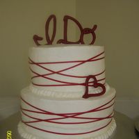 Picture_083.jpg 10" and 8" cakes, chocolate fudge with cream cheese filling. Buttercream frosting, and real ribbon wrapped around the cakes. &...