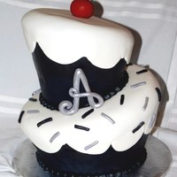 A Cherry On Top The client had showed me a cake from another website, but requested different color scheme. Cherry and letter are made with tylose