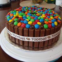 Kit Kat/m&m Cake Made this for the kids to enjoy for a Superbowl party. Thanks to who ever come up with this idea. Super easy and a crowd pleaser!