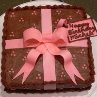 Brown And Pink With Bow Devil's food cake with chocolate frosting and gum paste bow.