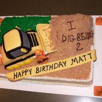 Bulldozer Cake Sheet cake with fondant bulldozer and fondant decorations.