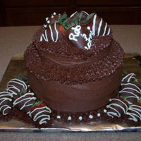 Summer_2008_014.jpg This is a cake I made for my parent's anniversary. It is chocolate with chocolate buttercream icing and chocolate covered strawberries...