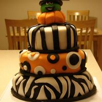 Halloween Party Cake My 2nd tiered cake ever for our halloween party. I used the Michelle's Fondant Recipe and the chocolate MMF fondant. I loved both much...