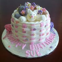 Kitten Basket Birthday Cake Lemon cake with a lemon mousse filling and covered with buttercream and fondant basketweave. Kittens and decorations are fondant/gumpaste....