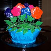 Flower Pot Flowers are cookies and pot is upside down doll pan from Wilton with oreo cookies as the dirt