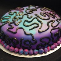 Tie Dye Cake I made this for a charity auction. I took left over fondant I had and mixed together and got this. I believe this cake went for $40 at the...