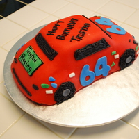 Race Car Cake made using Wilton's car pan, Covered in fondant with buttercream for tires.
