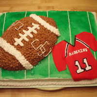 High School Football Cake Football cake for a friend of mines son who plays on his high school football team. I made the jersey to actually look like his jersey.