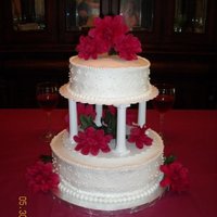 Round Wedding The round tier cake was actually used for a 40th anniversary celebration. The client wanted to use silk flowers to match with other...