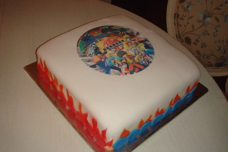 Bakugan Cake Chocolate WASC w/ chocolate icing covered in Satin Ice fondant. It was a hit. There is also an edible Bakugan image in the center. My...