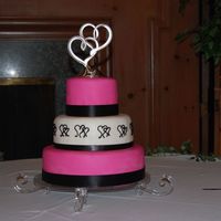 Fushia & Hearts Wedding Cake A joint project by myself & my good friend babyhugs (and her DH!) MMF covered, fabric ribbons, buttercream hearts freehanded. TFL