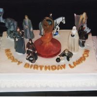 Landon's Cake Chocolate cake with buttercream. The letters are MMF with gold luster dust. The figures are Burger King toys I found on Ebay.