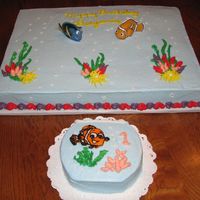 Benji's Cake This was for my nephew "s first birthday. Sheet cake is1/2 dark chocolat, 1/2 WASC with buttercream. Smash cake is 6"WASC with...