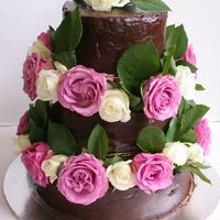 Img_5535.jpg chocolate mud cake covered in chocolate ganache and decorate with fresh roses
