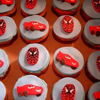 Img_4916.jpg Fondant covered cupcakes with Spiderman and Lightning McQueen.