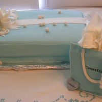 Breakfast At Tiffany's For a niece's bridal shower. It was a Breakfast at Tiffany's Theme. I came up with this box design and gift bag. All fondant,...