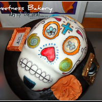 Day Of The Dead Skull Cake I loved making this cake! The cake was covered in fondant and then hand painted. All decor is either, chocolate, RI, or fondant. Thanks for...