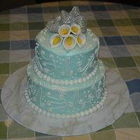 First Scroll Work Cake Tifany blue icing with white BC scroll work...All BC. Gumpaste calla lillies on top with real ribbon bow.
