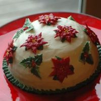 Christmas 2006 Cake, First Try At Poinsettias And Holly Round Chocolate and White Chocolate Mouse Cake with White Chocolate Almond Icing. Poinsettias were made on foil in a shot glass (I don'...