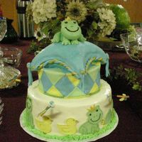 Froggy Tales This is a 12"& 8" round and an 8" square pillow. BC with fondant accents, and figures. The 3D frog is gumpaste and...