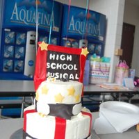 High School Musical The bottom: 8inch dbl layer covered in almond buttercream.The top: 6inch dbl layer covered in almond buttercream.The accent pieces are mmf...
