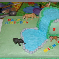 Jungle Birthday This cake is a dbl layer 11x13 with a dbl layer 6in cake on top. The bottom is almond buttercream & the top is covered in fondant. The...