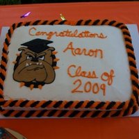 Happy Graduation!! This a dbl layer marbled 11x13cake. Frosted in buttercream w/a royal transfer.