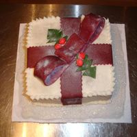 Christmas Cake 2 Christmas Cake 2, buttercream icing using the paint roller method on crusted buttercream. Fondant bow and holly.