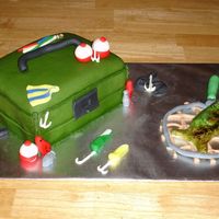 Tackle Box Cake Tackle box covered in fondant with fondant and royal icing decorations. Fish is sculpted in fondant and painted with watered down food...