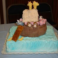 Noahs_Ark_3.jpg Noah's ark cake for baby shower with mmf animals and chocolate mmf ark planks. Buttercream airbrushed water.