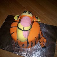 Tigger 3D Tigger cake with fondant. The head is sculpted cake covered in fondant.