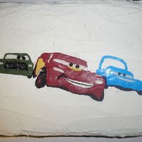 Racing Cars Frozen BC frosting transfer on 2-layer chocolate cake with BC frosting.