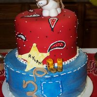 Cowboy Cake Cake was inspired by so many here on cc. Bottom layer 8"buttercake w/ caramel cream cheese filling covered with bc. 6" top Darn...