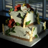 Tropical Wedding First Wedding cake. Couple eloped to Hawaii and threw a themed bash when they got back. Buttercream with Fondant accents